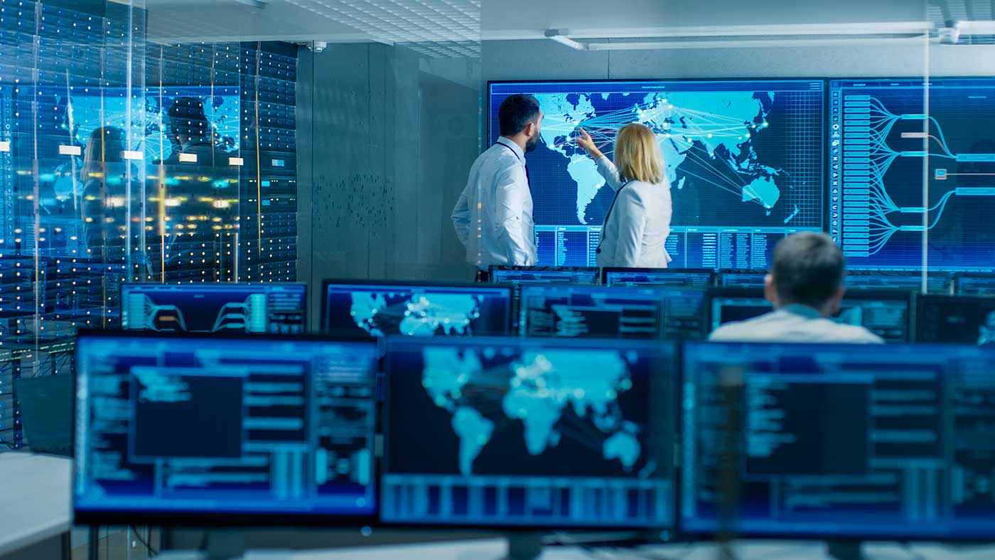 2 people in an room full of computers