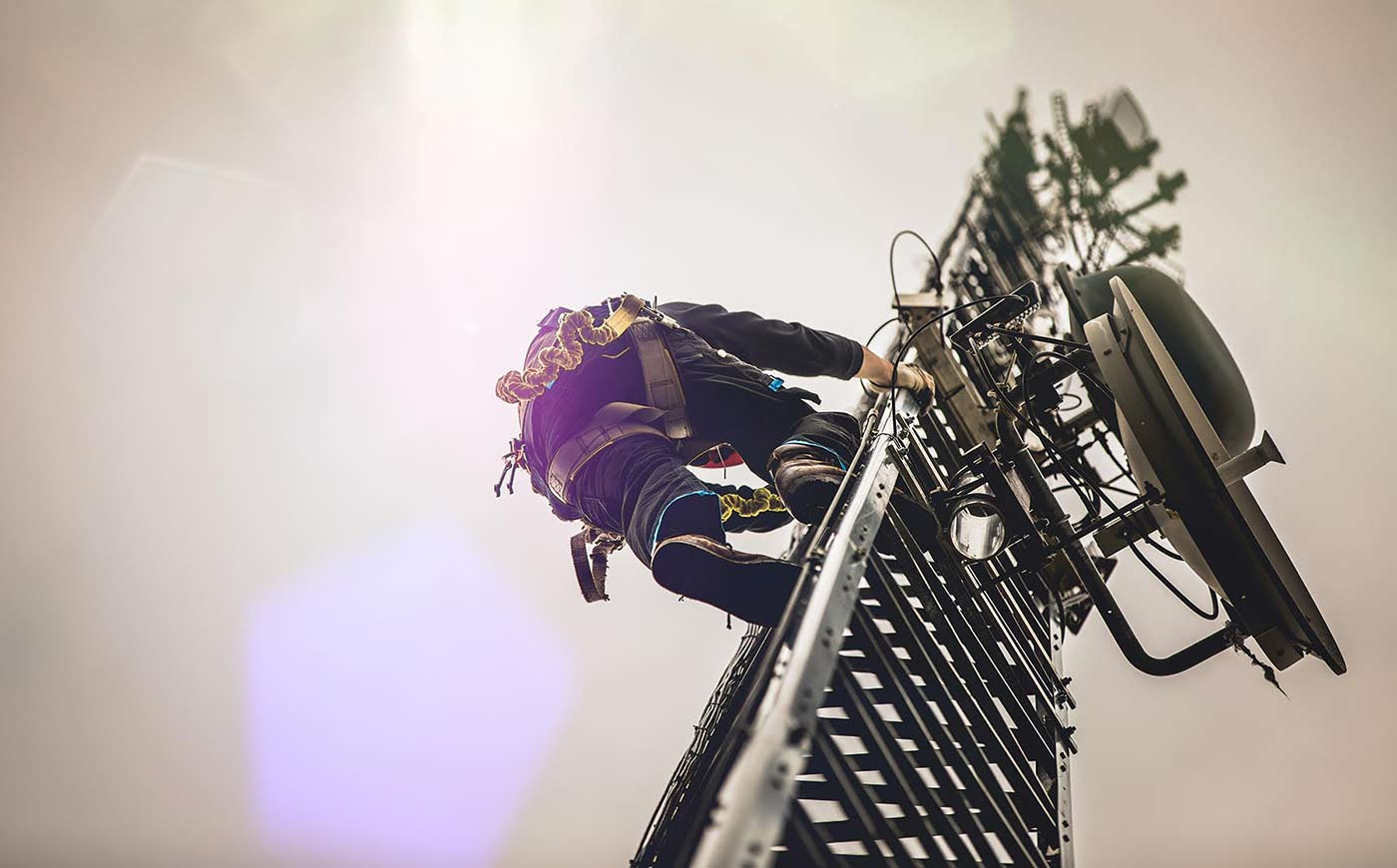 Man climbing cell tower